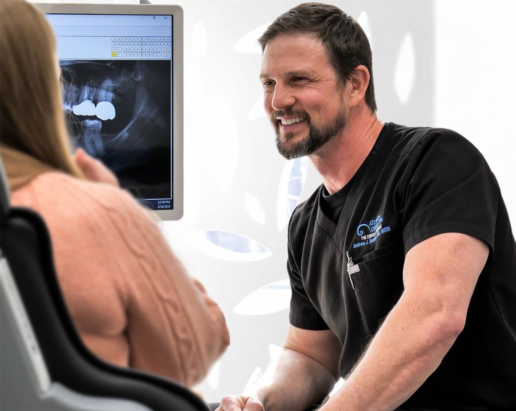 Dr. Hamilton listening to a patient during a consultation